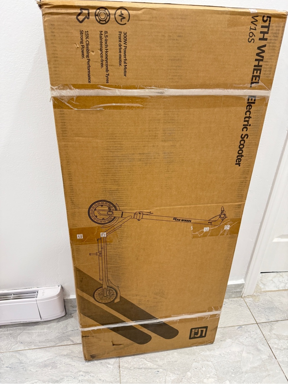 5th Wheel Electric Scooter in Brown Cardboard Box